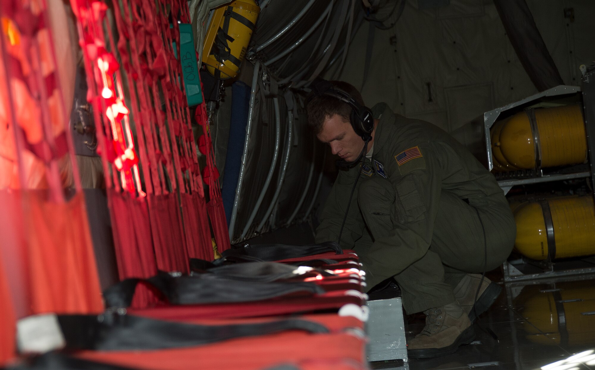 Staff Sgt. Derek Lyles, 349th Air Refueling Squadron boom operator, performs a preflight inspection inside a KC-135 Stratotanker November 8, 2013, at McConnell Air Force Base, Kan. The inspection was part of Lyles check ride, a flight where he is evaluated for his upgrade training. (U.S. Air Force photo/Airman 1st Class Colby L. Hardin)