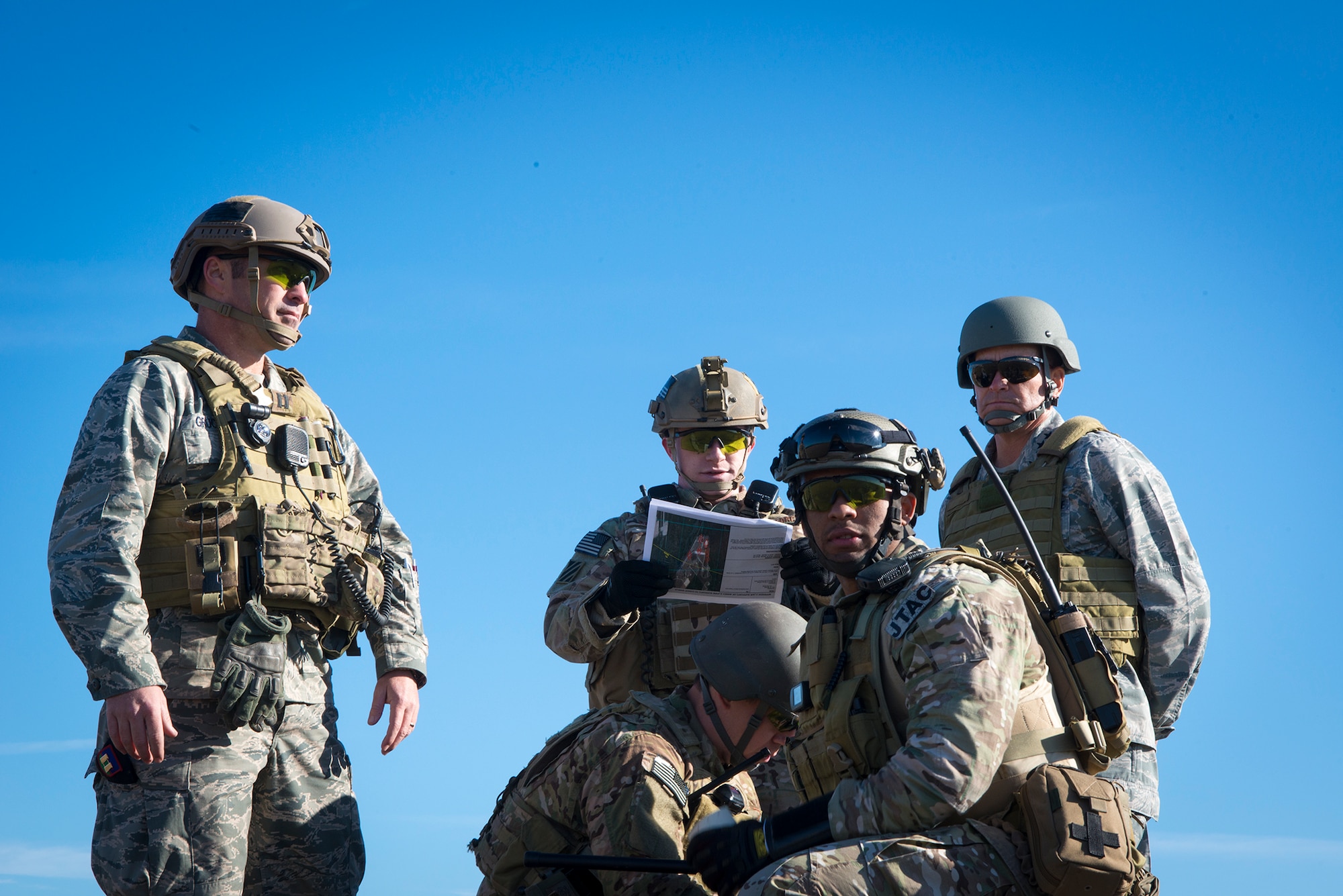 U.S. Air Force Maj. Gen. Jake Polumbo, right, Ninth Air Force commander, observes a group of tactical air control party airmen during a visit to Moody Air Force Base, Ga., Nov. 14, 2013. The TACPs directed A-10C Thunderbolt II aircraft to specific targets for strafing runs and show of force maneuvers. (U.S. Air Force photo by Airman 1st Class Ryan Callaghan/Released)

