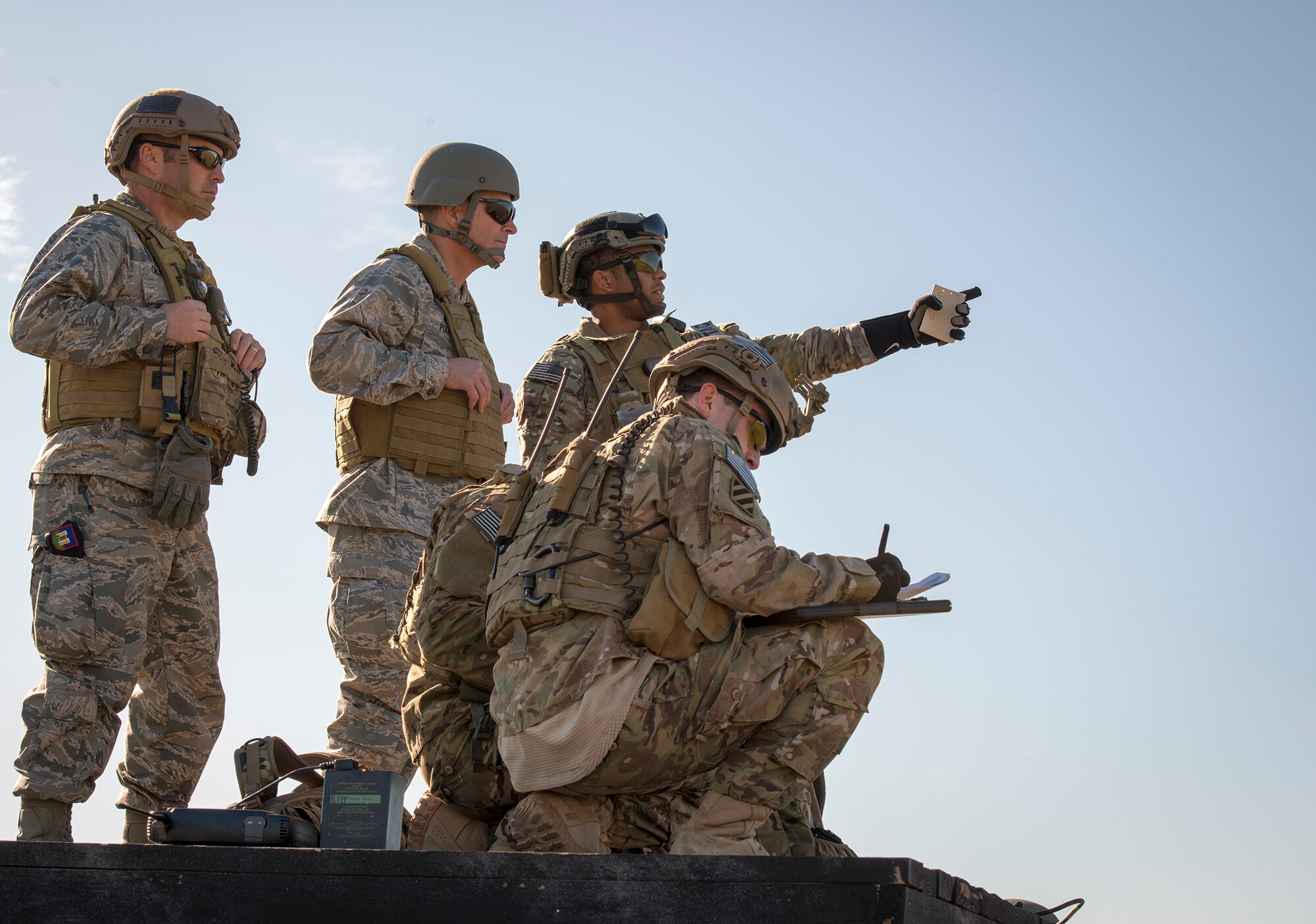 U.S. Air Force Maj. Gen. Jake Polumbo, second from left, Ninth Air Force commander, participates in a tactical air control party exercise during a visit to Moody Air Force Base, Ga., Nov. 14, 2013. Polumbo assisted in ordering several A-10C Thunderbolt II strafing runs at Moody’s Grand Bay Bombing and Gunnery Range. (U.S. Air Force photo by Airman 1st Class Ryan Callaghan/Released)

