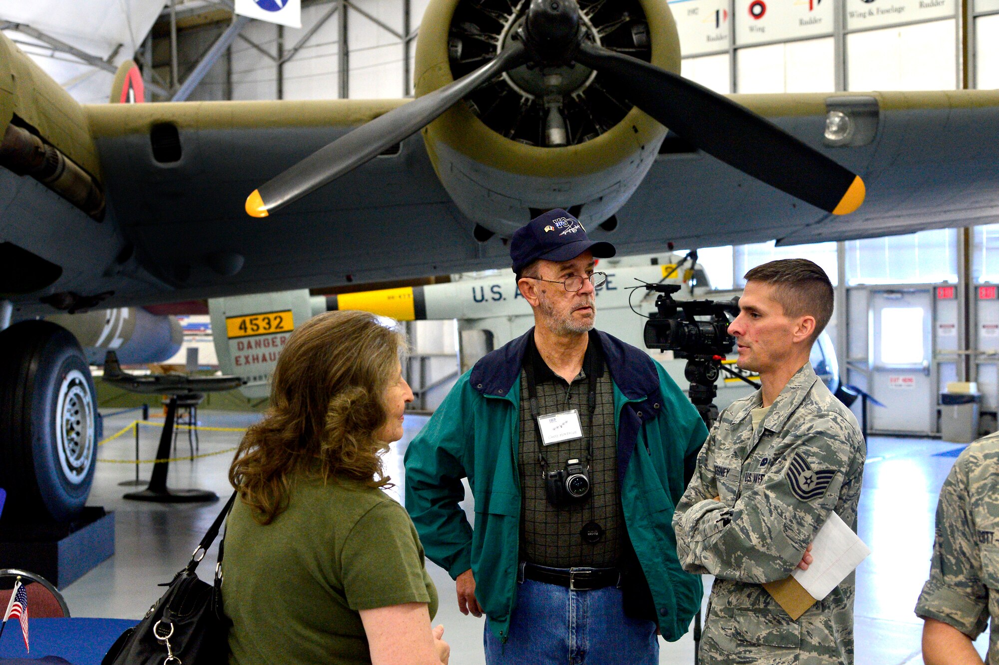 Tech. Sgt. Dale Gosney interviews family members of World War II Veterans Oct. 18, 2013 at the Air Mobility Command Museum on Dover Air Force Base, Del. Tech. Sgt. Gosney is an Air Force Videographer assigned to the 463th Airlift Wing Public Affairs Office. (U.S. Air Force photo/David S. Tucker)