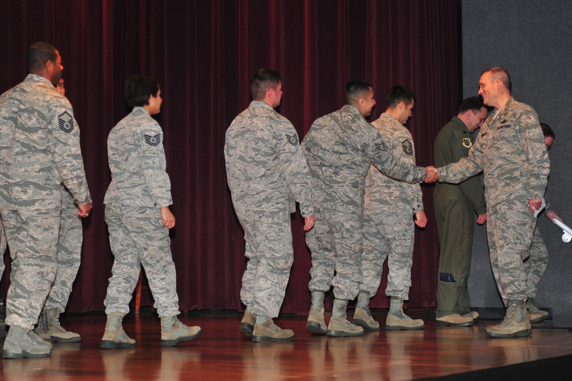 Col. Brian Newberry, 92nd Air Refueling Wing commander, shakes hands with the Wing Inspection Team after swearing them in at Fairchild Air Force Base, Wash., Nov. 13, 2013. The WIT should consist of a sufficient number of subject matter experts from within the Wing to conduct the Commanders Inspection Program under the authority of the Wing commander, under the direction of the Wing Inspector General/CCIP Director. Specific duties include providing inputs for scenario development, inspecting assigned areas and functions, evaluating scenarios, participating in the hot wash and providing inputs to the inspection report during exercises. (U.S. Air Force photo by Senior Airman Taylor Curry/Released)