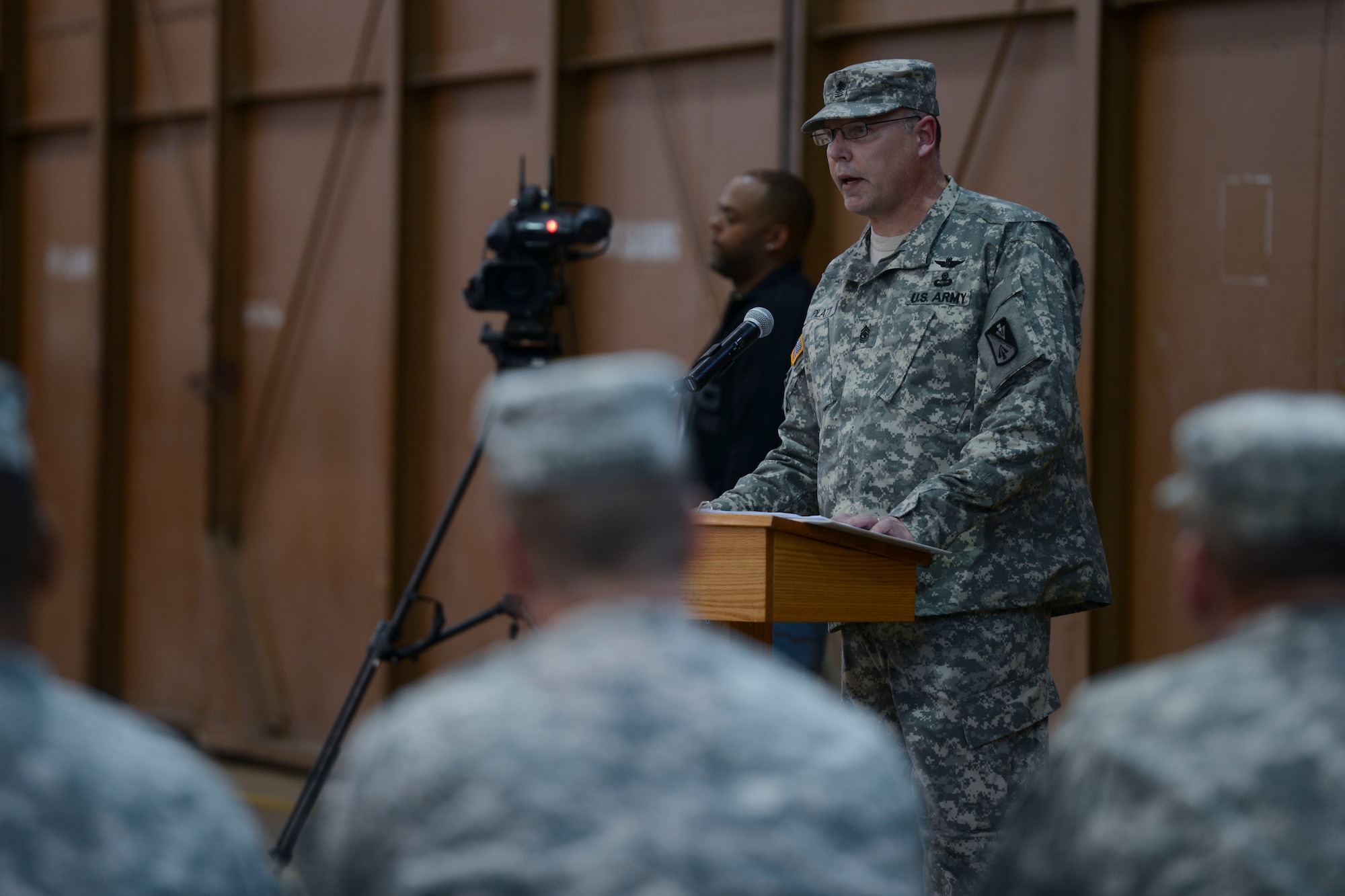 U.S. Army Sgt. Maj. William L. Platt, outgoing 1st Battalion, 210th Aviation Regiment sergeant major, speaks to attendees during the change of responsibility ceremony at Fort Eustis, Va., Nov. 15, 2013. Platt spoke about his experiences as the unit’s sergeant major and thanked members of the unit for support during his leadership. (U.S. Air Force photo by Staff Sgt. Ciara Wymbs/Released)