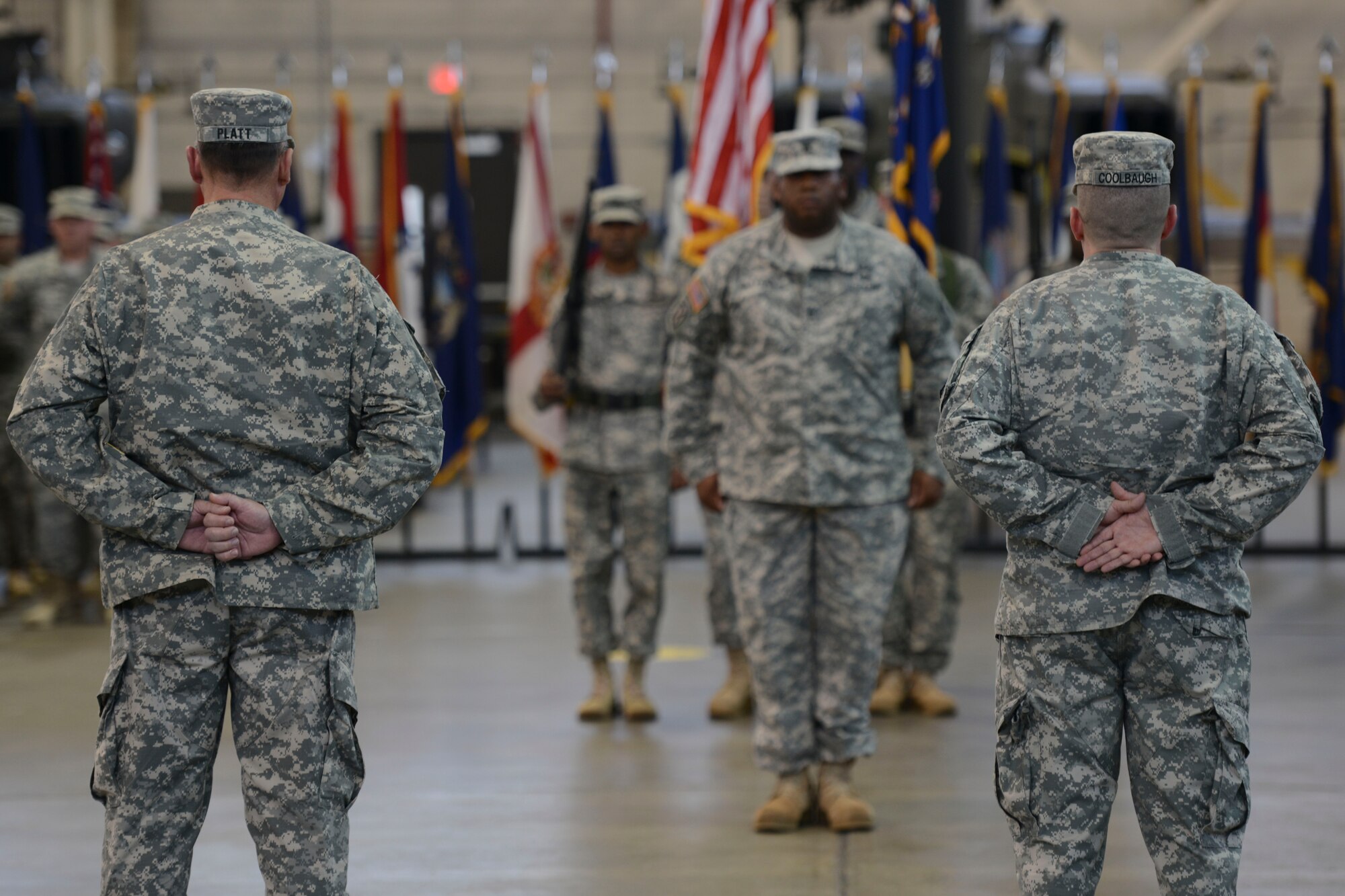 U.S. Army Sgt. Maj. William L. Platt, 1st Battalion, 210th Aviation Regiment outgoing sergeant major, left, and Sgt. Maj. Christopher Coolbaugh, incoming 1-210th Avn. Rgt. sergeant major, right, stand at parade rest after the 1-210th Avn. Rgt. change of responsibility ceremony at Fort Eustis, Va., Nov. 15, 2013. Platt is retiring after more than 30 years of service. (U.S. Air Force photo by Staff Sgt. Ciara Wymbs/Released)