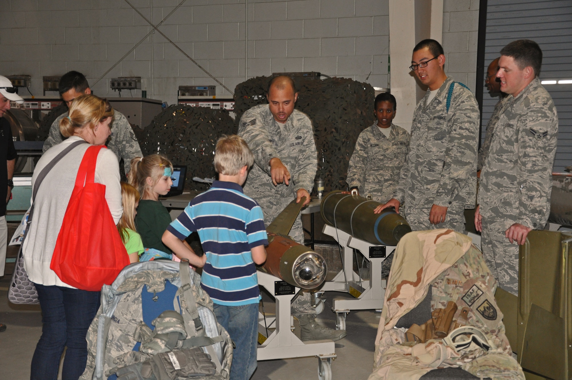 GOODFELLOW AIR FORCE BASE, Texas- Members from the 315th Training Squadron show attendees the equipment they use in their job during the 33rd Annual Goodfellow Community Appreciation Day at the Louis F. Garland Department of Defense Fire Academy Nov. 18. Community Appreciation Day allowed for members of the San Angelo community to come on base to see demonstrations and displays provided by several units. (U.S. Air Force photo/ Airman 1st Class Erica Rodriguez)