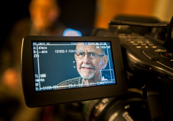Earl Lenhart, 781st Bombardier Squadron veteran, visits the 1st Combat Camera Squadron, Nov. 13, 2013, at Joint Base Charleston – Air Base, S.C. The veterans volunteered to have their stories documented by Combat Camera for an upcoming project. The 781st Bomb Squadron has held an annual reunion for more than 30 years and this year the host city was Charleston, S.C. While visiting the city, the veterans were given the opportunity to experience the mission at Joint Base Charleston during a base tour. (U.S. Air Force photo / Senior Airman Tom Brading) 