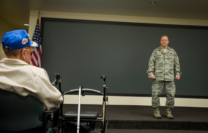 Col. Jeffrey DeVore, Joint Base Charleston commander, provides a JB Charleston mission brief to veterans of the 781st Bombardier Squadron and their families during their annual reunion Nov. 13, 2013, at JB Charleston, S.C. The group has held an annual reunion for more than 30 years. This year the host city was Charleston, S.C. While visiting the city, the veterans were given the opportunity to experience the mission at JB Charleston during a base tour. (U.S. Air Force photo / Senior Airman Tom Brading) 