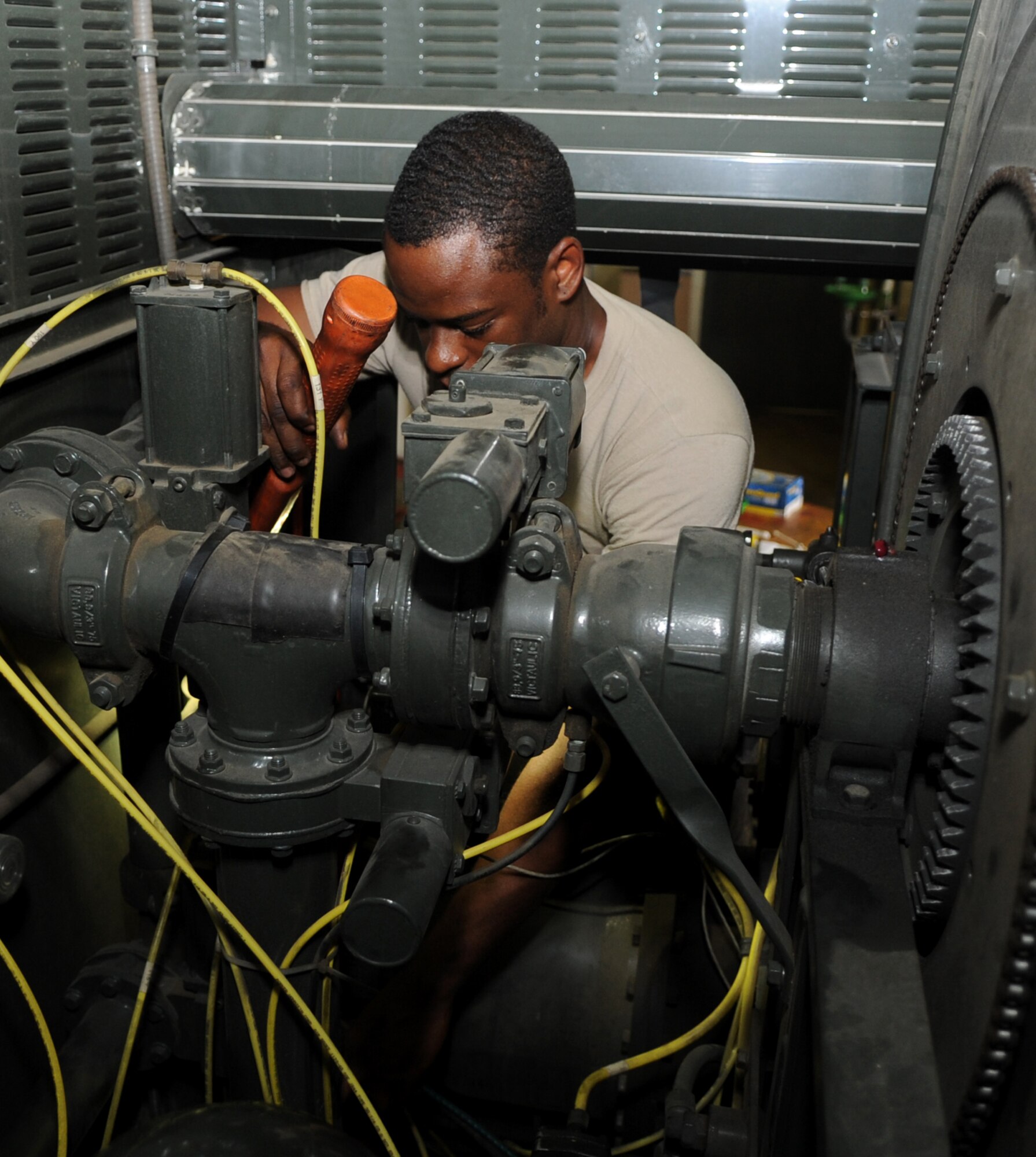 Senior Airman Michel Clement, a 19th Logistics Readiness Squadron refueling maintenance journeyman, troubleshoots a fuel pump on a aircraft refueler Sept. 11, 2013, at Little Rock Air Force Base, Ark.  Routine maintenance is performed on aircraft refuelers to keep the aircraft in the air. (U.S. Air Force photo by Staff Sgt. Caleb Pierce)