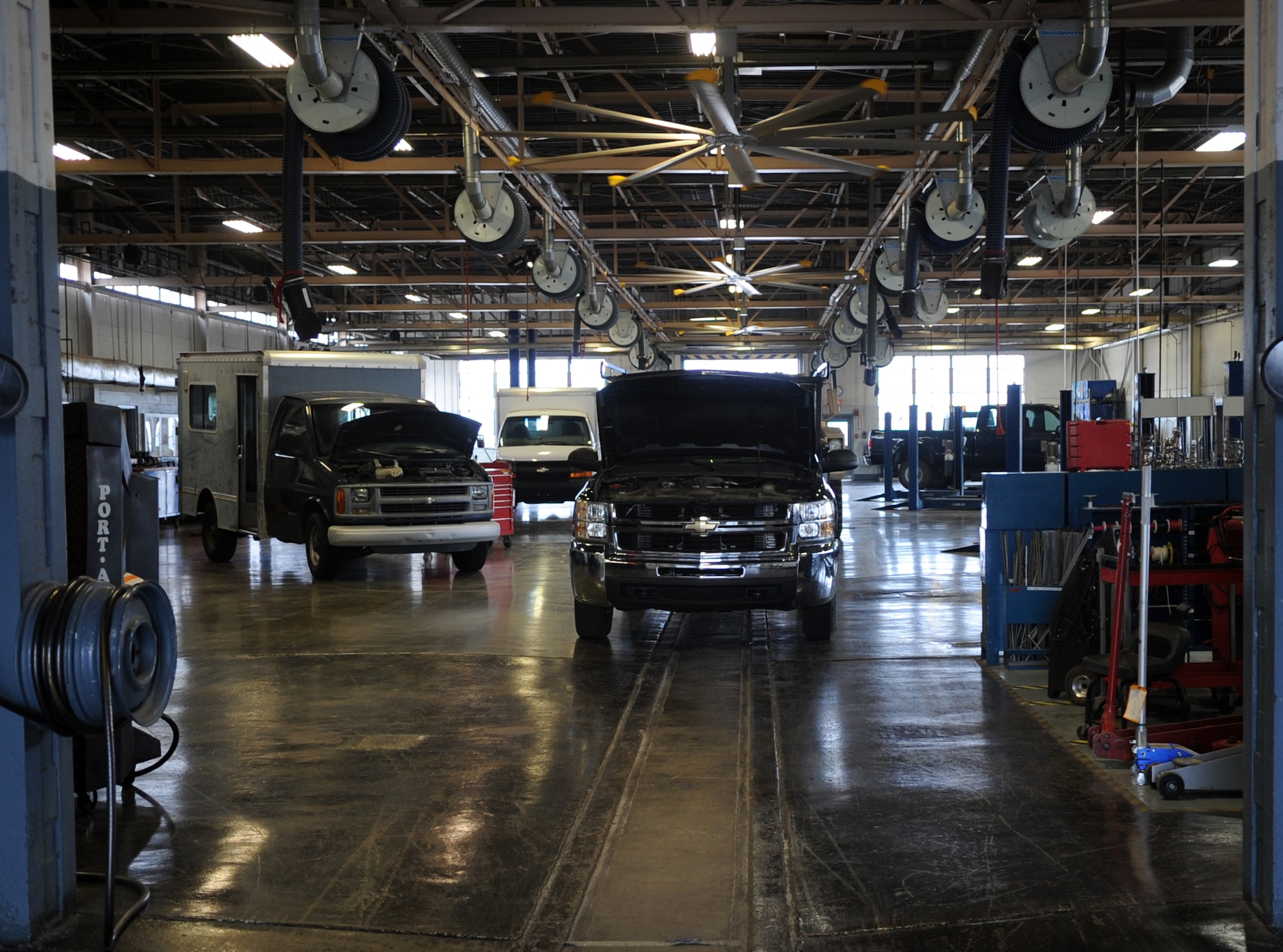 Vehicles sit in a bay at the 19th Logistics Readiness Squadron vehicle management flight Sept. 11, 2013, at Little Rock Air Force Base, Ark. The vehicle management flight services and maintains 435 vehicles for three commands and 28 tenant units. (U.S. Air Force photo by Staff Sgt. Caleb Pierce) 