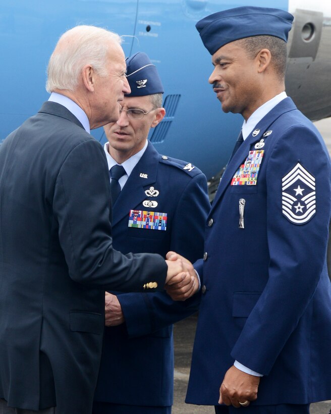 Col. Mathew Alinson, 147th Mission Support Group Commander, and Chief Master Sgt. Marlon Nation, 147th Reconnaissance Wing Command Chief Master Sgt., greet Vice President Joe Biden after his arrival at Ellington Field Joint Reserve Base Novemner 18, 2013 in Houston, TX. The Vice President was in Houston for an event at the Port of Houston.