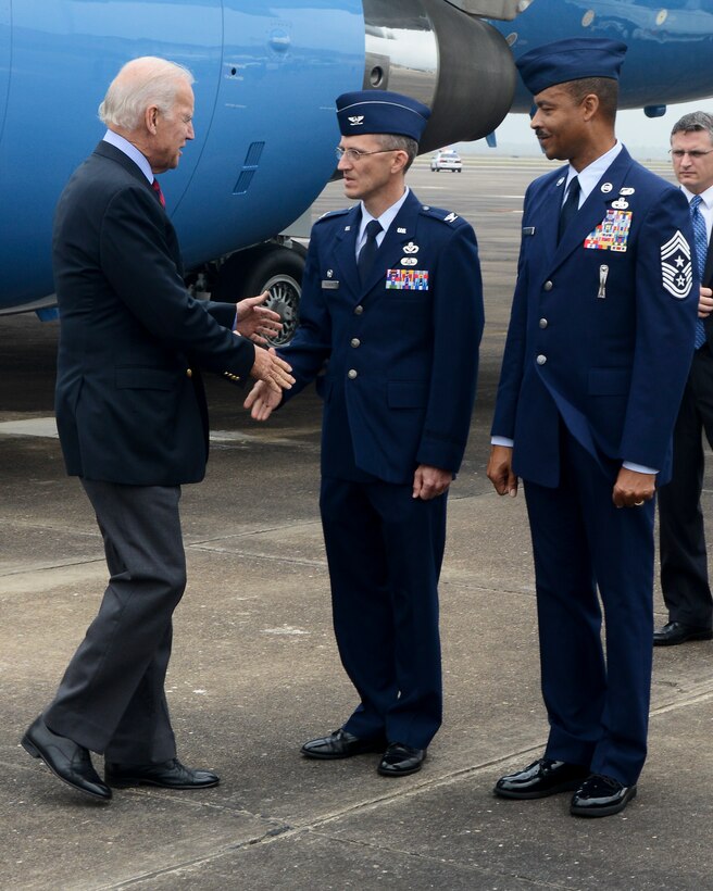 Col. Mathew Alinson, 147th Mission Support Group Commander, and Chief Master Sgt. Marlon Nation, 147th Reconnaissance Wing Command Chief Master Sgt., greet Vice President Joe Biden after his arrival at Ellington Field Joint Reserve Base Novemner 18, 2013 in Houston, TX. The Vice President was in Houston for an event at the Port of Houston.