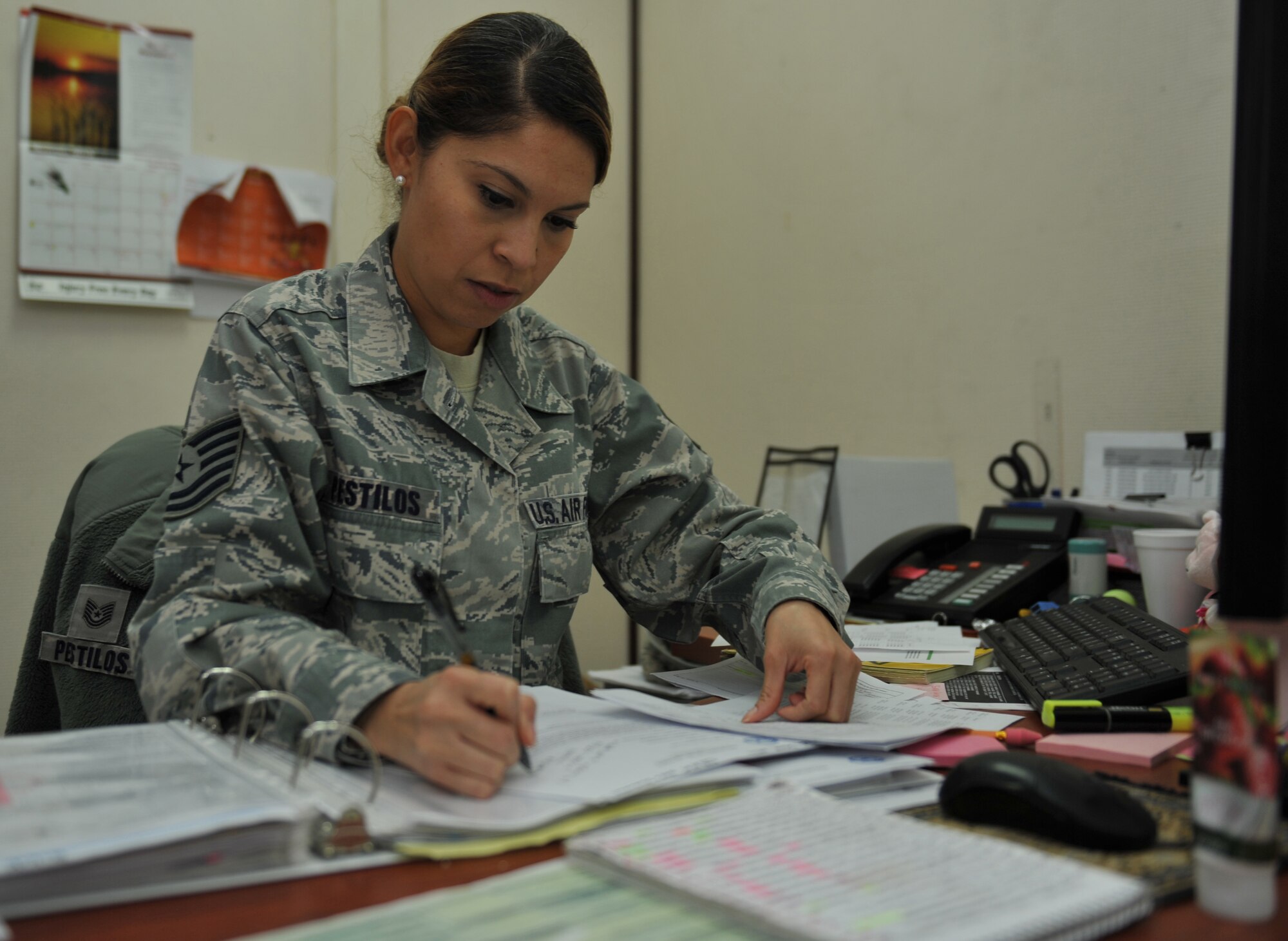 Tech. Sgt. Miriam Pestilos completes vehicle paperwork in Southwest Asia, Nov. 14, 2013. Pestilos is the 379th Expeditionary Logistics Readiness Squadron fleet manager. The fleet management section is responsible for managing and accounting for the base vehicle fleet. Pestilos is deployed from Mountain Home Air Force Base, Idaho and a Miami, native. (U.S. Air Force photo/Master Sgt. David Miller)