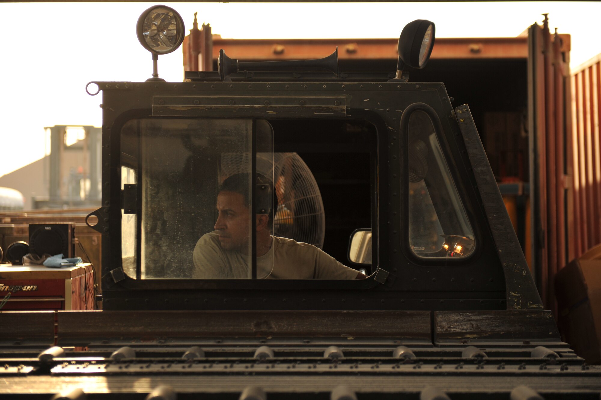 Staff Sgt. Carlo Rossi controls a Tunner 60K aircraft cargo loader during operations checks in Southwest Asia, Nov. 14, 2013. Rossi is a 379th Expeditionary Logistics Readiness Squadron special vehicle maintenance journeyman assigned to the special purpose vehicle team deployed from Luke Air Force Base, Ariz., and a Killeen, Texas, native. (U.S. Air Force photo/Master Sgt. David Miller)