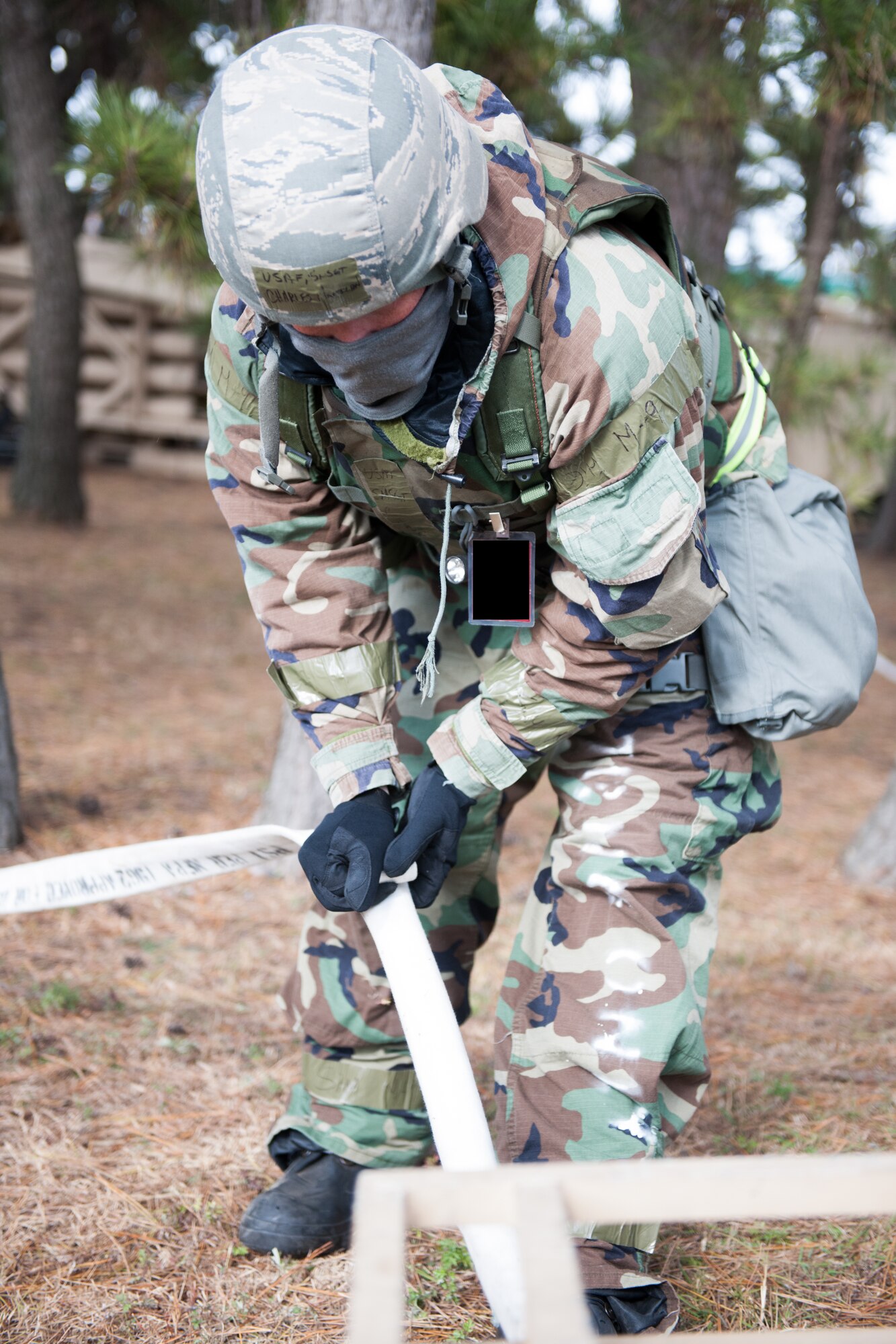 Senior Master Sgt. Charles Hamilton, 8th Civil Engineer Squadron, plugs a hose for a filtration system during Beverly Bulldog 14-01 at Kunsan Air Base, Republic of Korea, Nov. 19, 2013. Airmen from the 8th CES tested their ability to provide clean and potable water to the Wolf Pack. The 8th Fighter Wing is testing its wartime mission alongside other 7th Air Force units and supporting organizations with an emphasis on the operational and tactical levels of war during the peninsula-wide exercise. (U.S. Air Force illustration by Senior Airman Armando A. Schwier-Morales)