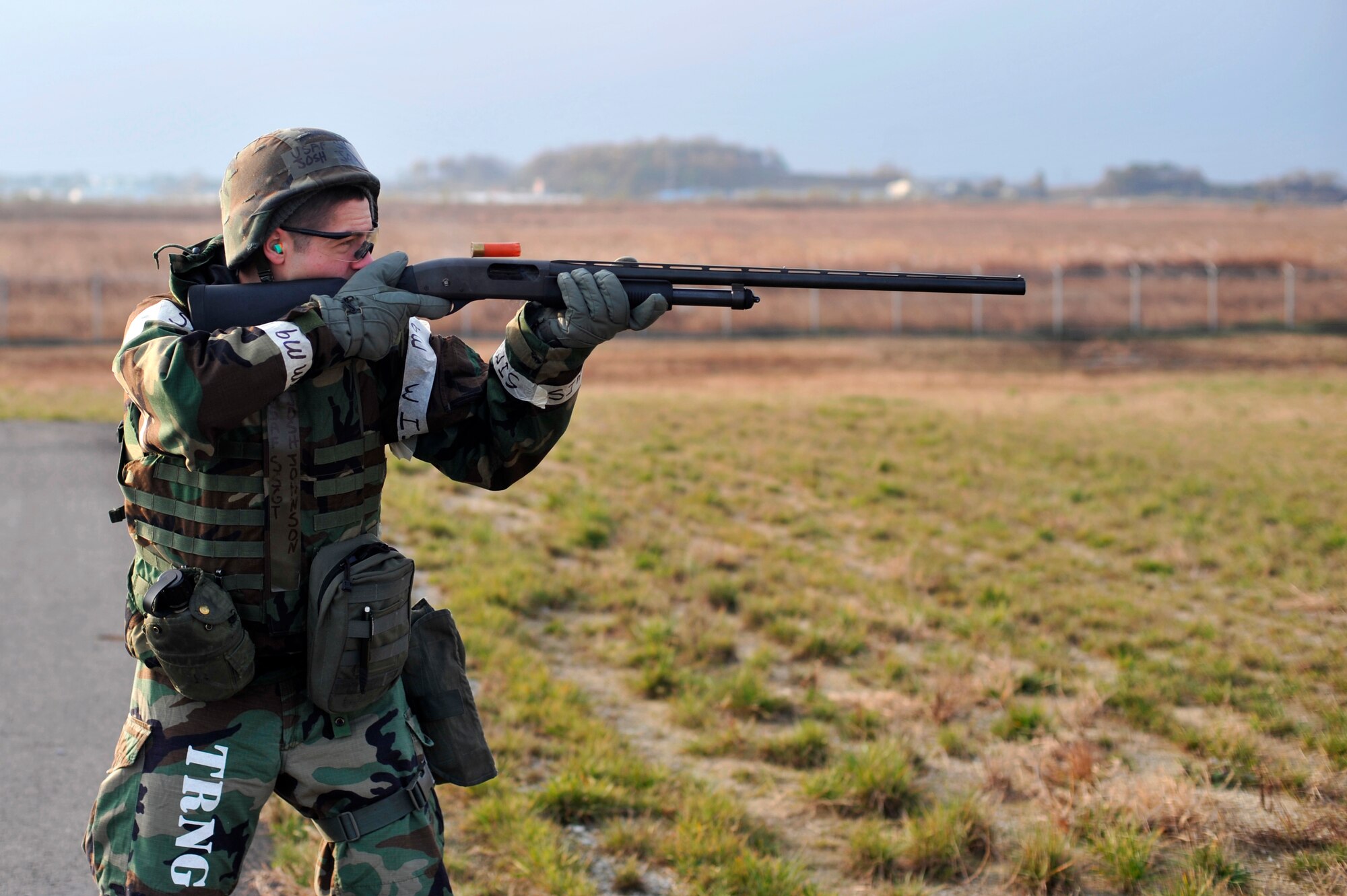 Staff Sgt. Joshua Johnson, 51st Operations Support Squadron's airfield maintenance operations supervisor, fires a shotgun to ward off animals from the runway during Operational Readiness Exercise Beverly Bulldog 14-01 at Osan Air Base, Republic of Korea, Nov. 19, 2013. Airfield managers are tasked with ensuring runways are safe and operable at all times, which includes making sure foreign objects and animals are cleared out of the way. (U.S. Air Force photo/Staff Sgt. Emerson Nuñez)