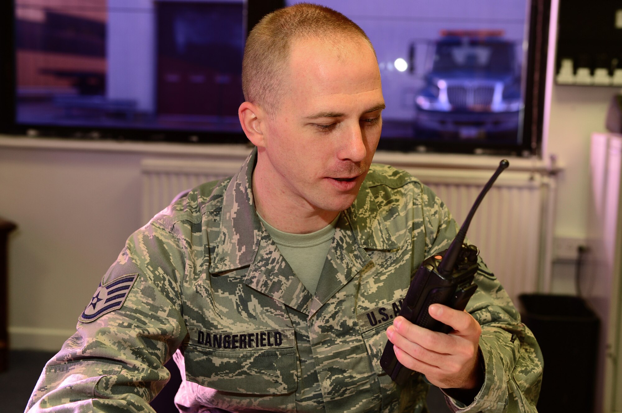 Staff Sgt. Ryan Dangerfield, 48th Logistics Readiness Squadron, Vehicle Operations Control Center NCO in charge, checks in with the base vehicle escort fleet at Royal Air Force Lakenheath, England, Nov. 15, 2013. Dangerfield was nominated for a Liberty Spotlight because he displays the core value of Service Before Self. (U.S. Air Force photo by Airman 1st Class Dawn M. Weber/Released)  