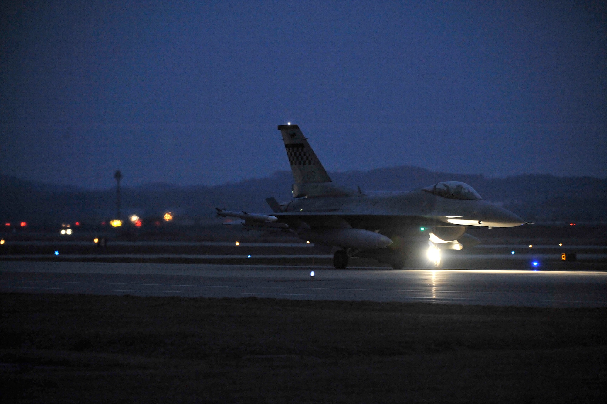 An F-16 Fighting Falcon from the 36th Fighter Squadron taxis down the flight line before taking off during the first combat sortie of Operational Readiness Exercise Beverly Bulldog 14-01 at Osan Air Base, Republic of Korea, Nov. 19, 2013. The wing executes military operations to beddown, maintain and employ follow-on forces for the combined arms base that includes three major flying tenants and large multiservice fighting units. (U.S. Air Force photo/Staff Sgt. Emerson Nuñez)