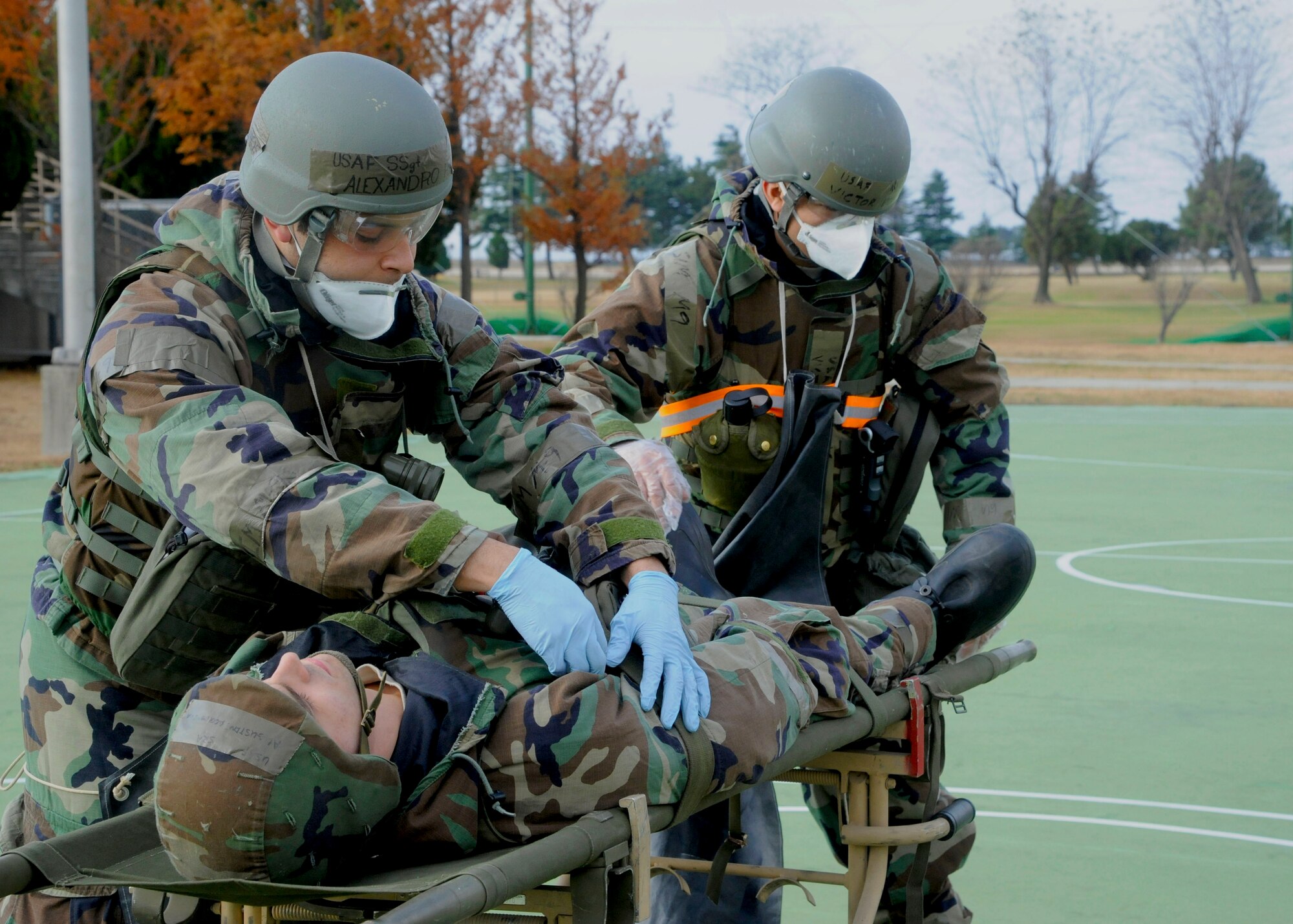 Staff Sgt. Alexandro Ramos, 8th Force Support Squadron, and Airman 1st Class Victor Bercian, 8th FSS, conduct a routine search of the simulated deceased during Exercise Beverly Bulldog 14-01 at Kunsan Air Base, Republic of Korea, Nov. 19, 2013.  Exercise Beverly Bulldog 14-01 demonstrates and enhances the readiness of 7th Air Force to defend and sustain the capabilities which strengthen the ROK-U.S. Alliance. (U.S. Air Force photo by Staff Sgt. Jessica Haas/Released)