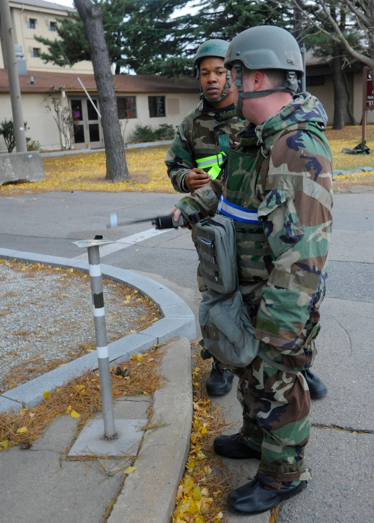 Tech. Sgt. Samuel Eller, 8th Comptroller Squadron, and Staff Sgt. Doron Smith, 8th CPTS, conduct par sweeps in their area of responsibility during Exercise Beverly Bulldog 14-01 at Kunsan Air Base, Republic of Korea, Nov. 19, 2013.  Exercise Beverly Bulldog 14-01 demonstrates and enhances the readiness of 7th Air Force to defend and sustain the capabilities which strengthen the ROK-U.S. Alliance. (U.S. Air Force photo by Staff Sgt. Jessica Haas/Released)