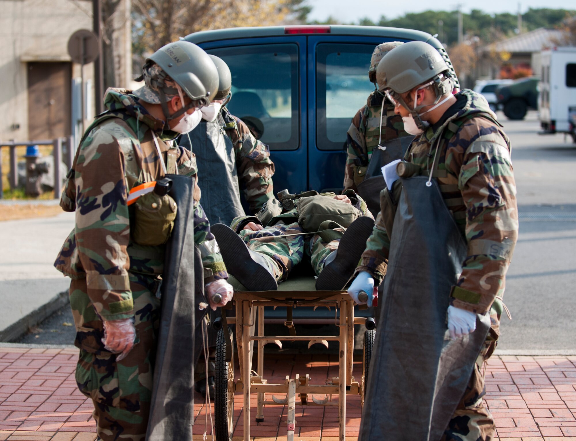 Airmen of the 8th Force Support Squadron move a simulated casualty during Exercise Beverly Bulldog 14-01 at Kunsan Air Base, Republic of Korea, Nov. 19, 2013. Exercise Beverly Bulldog 14-01 demonstrates and enhances the readiness of 7th Air Force to defend and sustain the capabilities which strengthen the ROK-U.S. Alliance. (U.S. Air Force photo by Senior Airman Clayton Lenhardt/Released)