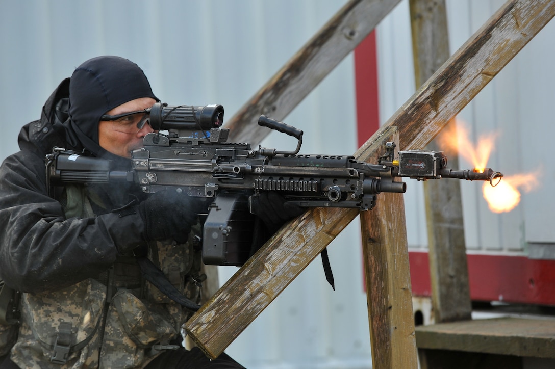 A U.S. Army soldier, assigned to  the opposing force, fires an M249 squad automated weapon during exercise Combined Resolve at the Joint Multinational Readiness Center, Hohenfels, Germany, Nov. 15, 2013. The soldier is assigned to 1st Battalion, 4th Infantry Regiment.

