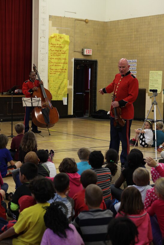 A string duo comprised of MGySgt Peter Wilson and MSgt Aaron Clay performed a Music in the Schools program at Murch Elementary School in Washington, D.C., Nov. 1, 2013. The Marine Band performed for approximately 8,000 students during its Music in the Schools Program, held throughout October. 