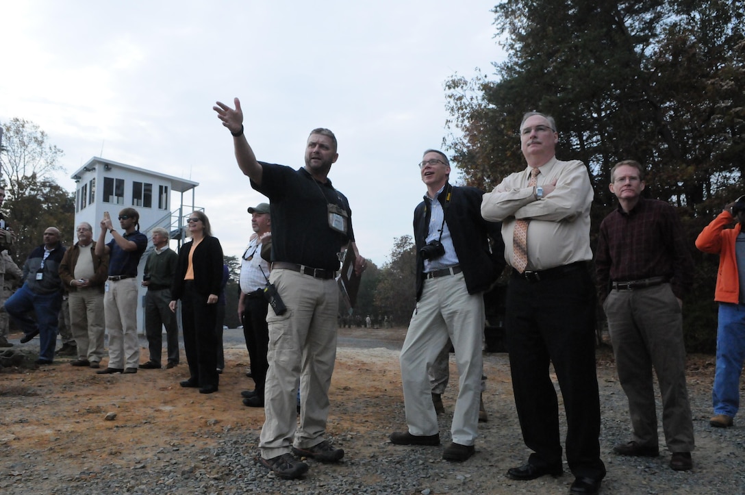 From left, Quantico Range Operations Officer James Woodfin explains live-fire explosive ordnance training to Ray Utz, chief of long-range planning for Prince William County; Jeff Harvey, director of Stafford County’s Planning and Zoning Department; and Dave Capaz, Stafford County’s geographic information systems manager, at Range 7, where The Basic School is conducting call-for-fire training Oct. 31. 