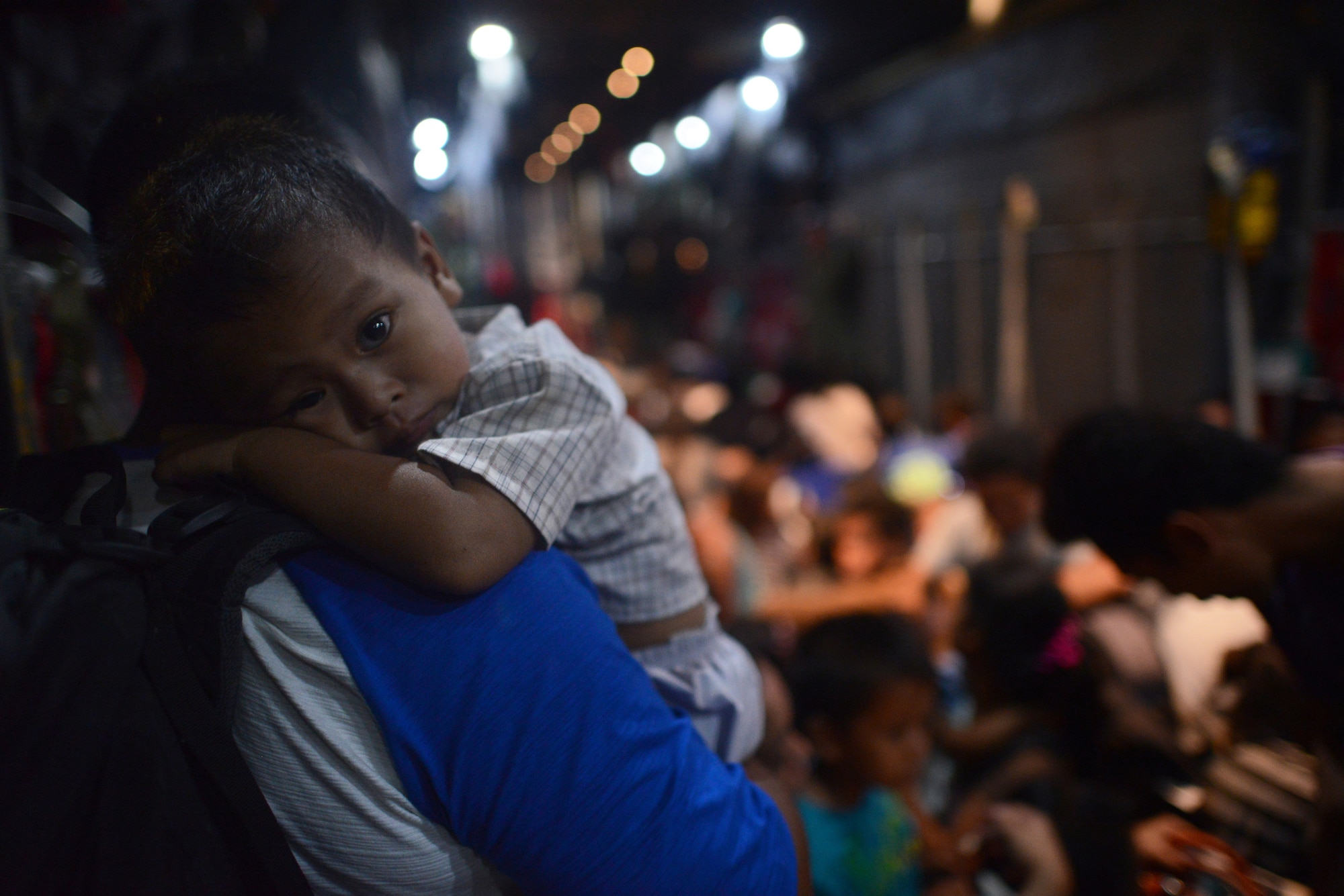 Evacuees board an Air Force C-130 Hercules Nov. 18, 2013 at Tacloban Airport, Republic of the Philippines, during Operation Damayan. Operation Damayan is a humanitarian aid and disaster relief operation led by the Philippine government and supported by a multinational response force. 