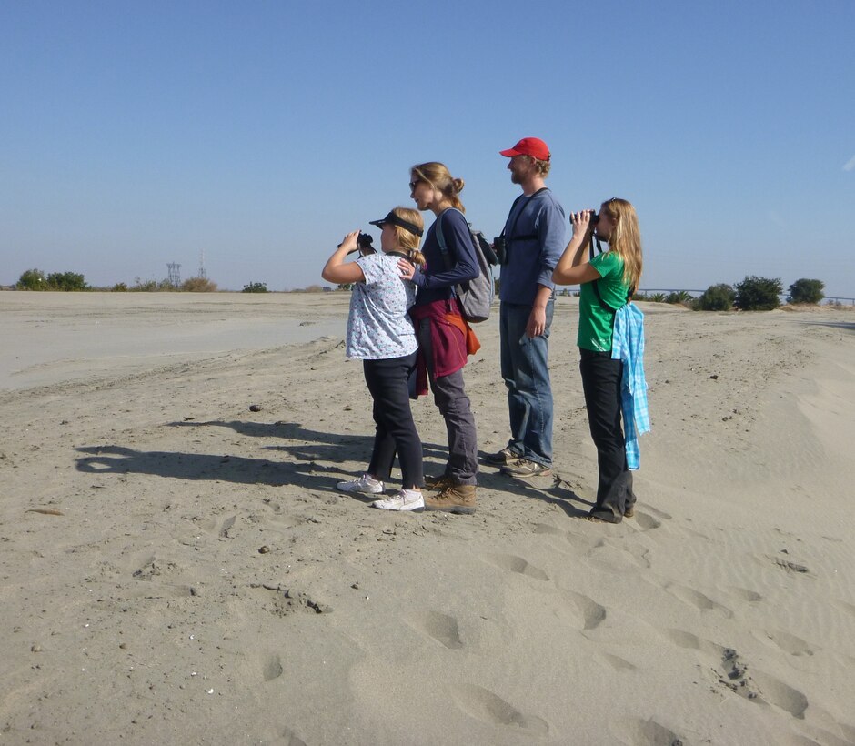 Visitors stand atop newly dredged river sand at the Antioch Dunes National Wildlife Refuge in Antioch, Calif., Nov. 9, 2013, the result of a unique partnership among the U.S. Fish and Wildlife Service, the U.S. Army Corps of Engineers Sacramento District and the Port of Stockton. The sand – dredged from the Stockton Deep Water Ship Channel to ensure navigability – will help restore the Antioch Dunes ecosystem, creating habitat on the refuge for such endangered species as the Lange’s metalmark butterfly, the Antioch Dunes Evening Primrose and the Contra Costa Wallflower. 