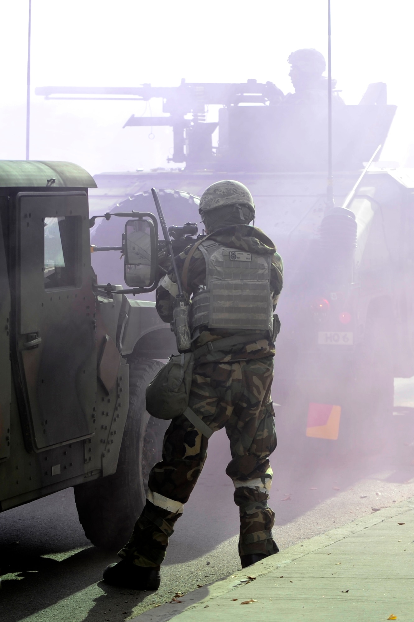 An Airman from the 51st Security Forces Squadron fires at an opposition forces member outside of the 35th Air Defense Artillery Brigade’s headquarters building during Operational Readiness Exercise Beverly Bulldog 14-01 at Osan Air Base, Republic of Korea, Nov.20, 2013. During this particular exercise scenario, 51st SFS defenders teamed up with 35th ADA Brigade soldiers to neutralize a ground attack. (U.S. Air Force photo/Staff Sgt. Emerson Nuñez)