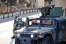 Soldiers from the 35th Air Defense Artillery Brigade respond to a ground attack outside of the unit’s headquarters building during Operational Readiness Exercise Beverly Bulldog 14-01 at Osan Air Base, Republic of Korea, Nov.20, 2013. This ORE marked the first time the 35th ADA Brigade teamed up with 51st Fighter Wing and 7th Air Force units during an exercise at Osan. (U.S. Air Force photo/Staff Sgt. Emerson Nuñez)