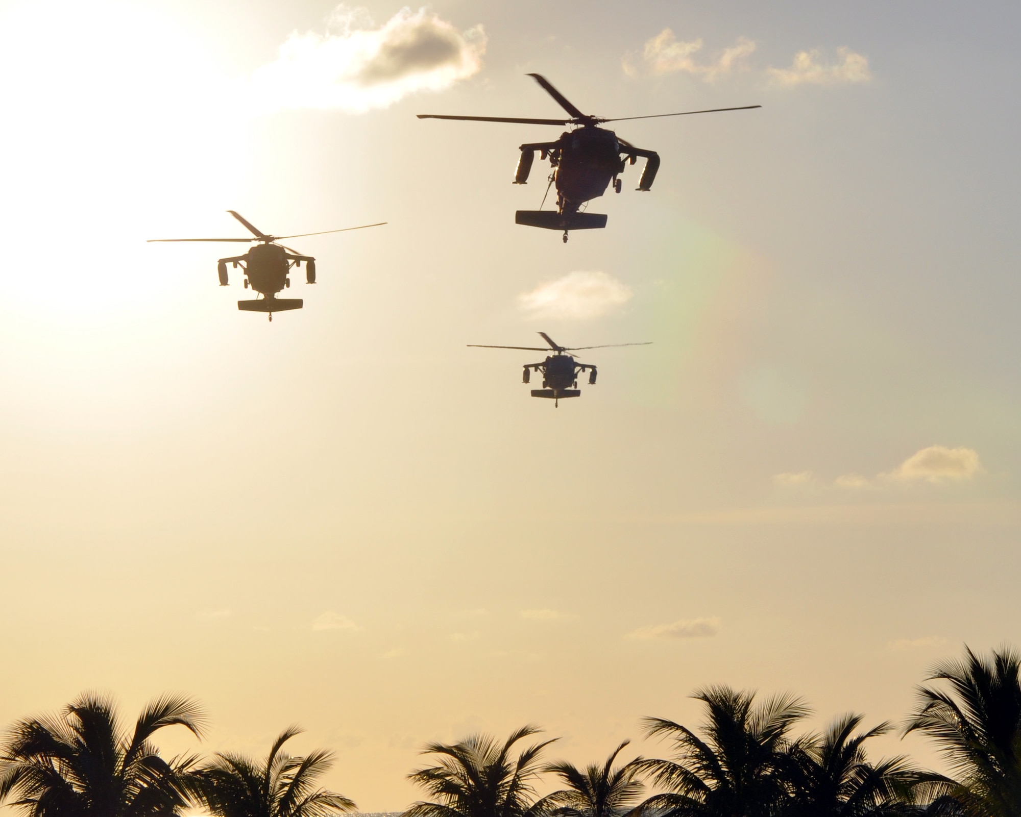 A formation of three UH-60 Blackhawk helicopters assigned to Joint Task Force-Bravo's 1-228th Aviation Regiment makes an approach for a landing at Puerto Castilla, Honduras, Nov. 19, 2013.  The helicopters were flying a mission that was part of a week-long Collective Training Exercise (CTE) being conducted by the 1-228th.  (U.S. Air Force photo by Capt. Zach Anderson)