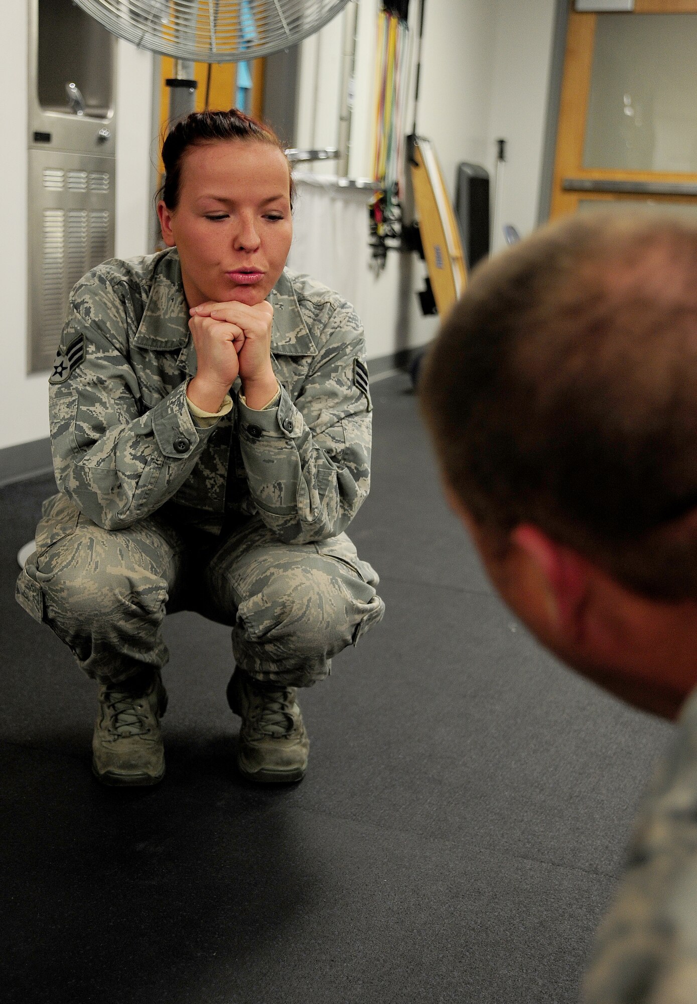 U.S. Air Force Senior Airman India Meserve, 509th Medical Operations Squadron physical therapy technician, instructs U.S. Air Force Tech. Sgt. Thomas Dawson, 509th Civil Engineer Squadron, during a physical therapy exercise session at Whiteman Air Force Base, Mo., Nov. 8, 2013. As a physical therapy technician, Meserve’s job is to help provide evidence-based care to reduce pain and restore function following musculoskeletal injuries or orthopedic surgery for Whiteman's active-duty population. (U.S. Air Force photo by Staff Sgt. Nick Wilson/Released)
