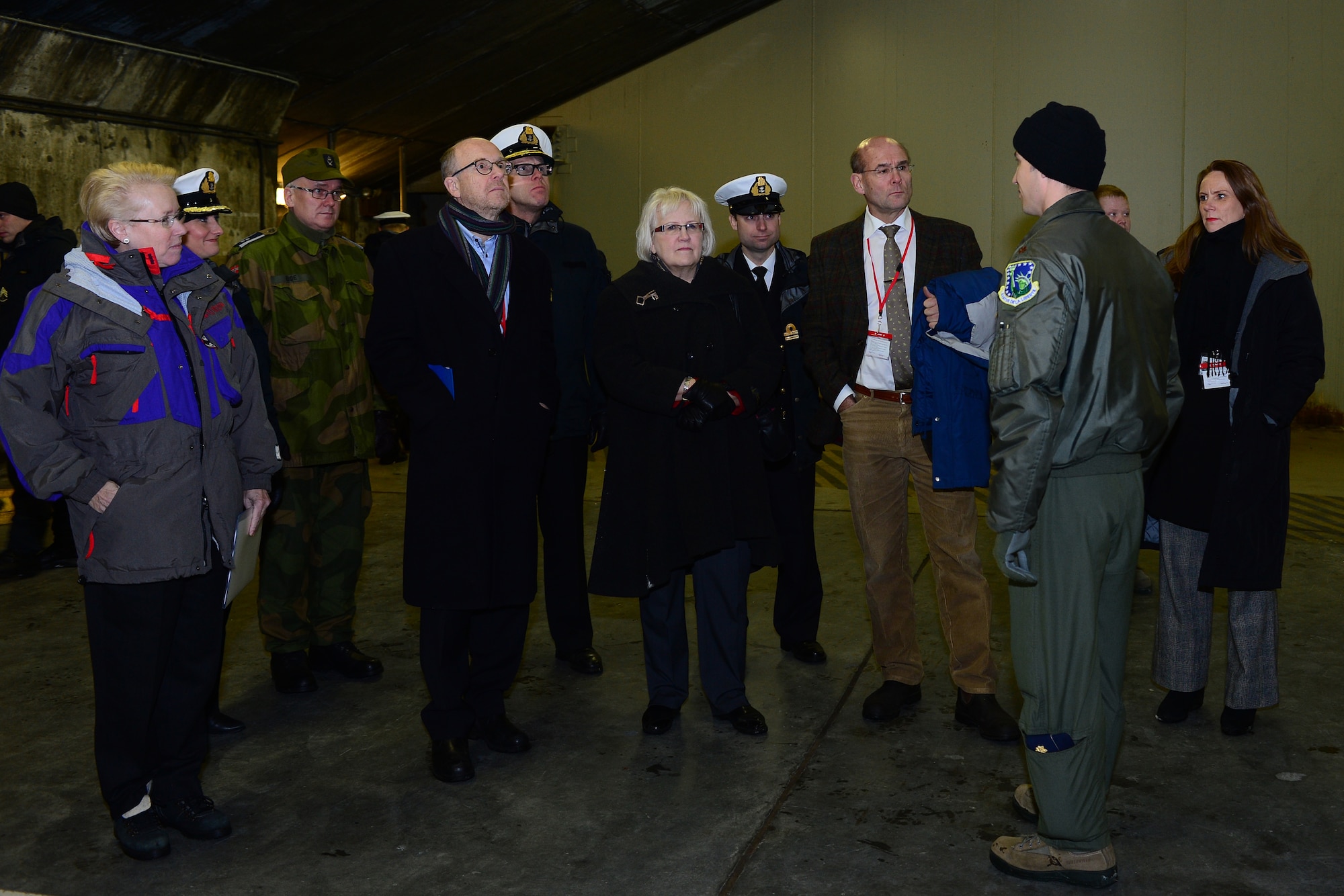 Maj. Jason Bianchi, 48th Air Expeditionary Group liaison officer, briefs Nordic Ambassadors on the capabilities of the F-15C Eagle during a tour at Keflavik International Airport, Iceland, Nov. 18, 2013. The 48th Air Expeditionary Group conducts tours to highlight and further explain why the U.S. Air Force supports air policing and surveillance missions while deployed to Iceland. Visiting groups also received aircraft static displays of a KC-135 Stratotanker and a C-130J. (U.S. Air Force photo by Airman 1st Class Dana J. Butler/Released)