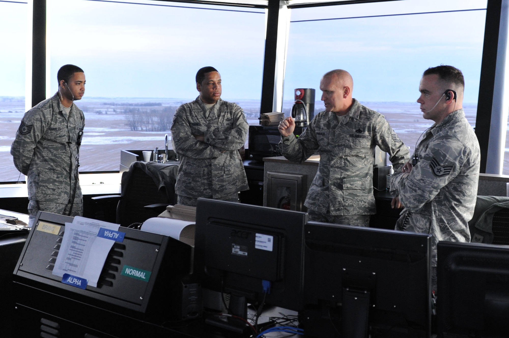 Chief Master Sgt. Brian Hornback, command chief for Air Force Global Strike Command, tours the air traffic control tower during a visit to Minot Air Force Base, N.D., Nov. 19. Airmen spoke to Hornback about the new facility. The chief discussed changes in airfield operations he has observed over his time as command chief. (U.S. Air Force photo/Senior Airman Stephanie Sauberan)
