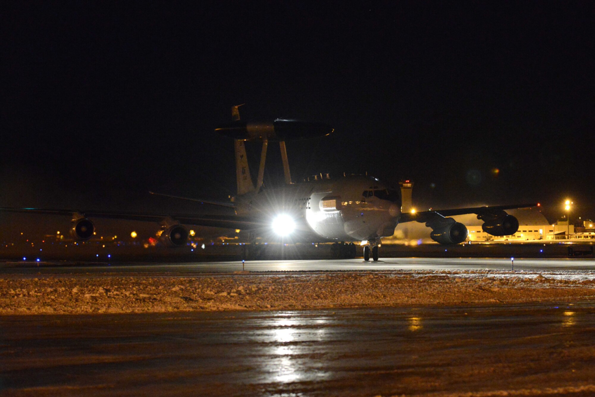An E-3 Sentry from the 962nd Airborne Air Control Squadron taxis down the runway after performing night-time operations on Joint Base Elmendorf-Richardson, Alaska, Nov. 17, 2013. The Sentry is an airborne warning and control system aircraft that provides all-weather surveillance, command, control and communications. (U.S. Air Force photo/Staff Sgt. Sheila deVera)