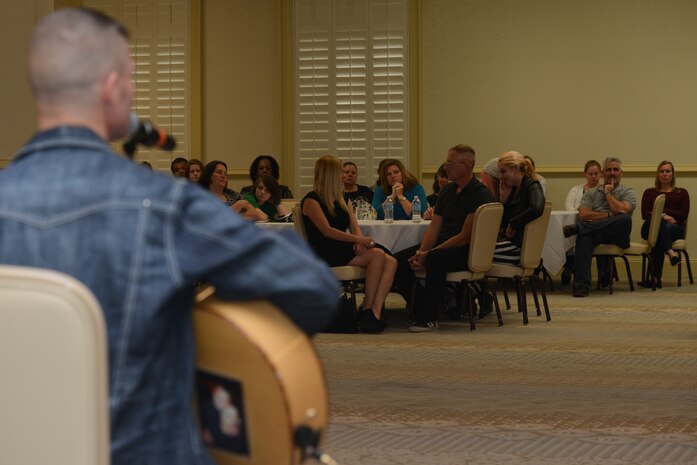 America's Got Talent contestant Jimmy Rose performs after taking pictures and shaking hands with military service members and their families Nov. 15, 2013, at Joint Base Charleston – Air Base, S.C. Rose, a country singer, songwriter and guitarist, finished in 3rd place on the shows eighth season. Rose is a U.S. Marine veteran originally from Pineville, Ky. (U.S. Air Force photo/ Airman 1st Class Chacarra Neal)