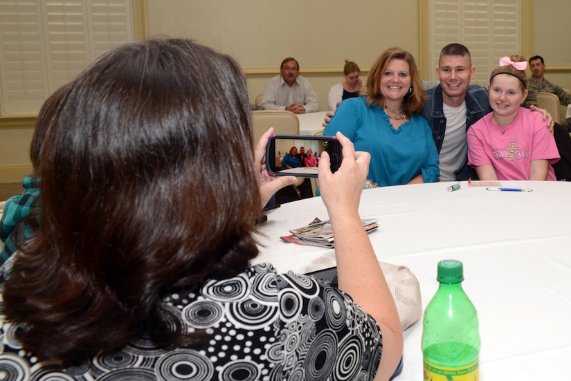 America's Got Talent contestant Jimmy Rose poses for photographs with military service members and their families Nov. 15, 2013, at Joint Base Charleston – Air Base, S.C. Rose, a country singer, songwriter and guitarist, finished in 3rd place on the shows eighth season. Rose is a U.S. Marine veteran originally from Pineville, Ky. (U.S. Air Force photo/ Airman 1st Class Chacarra Neal)