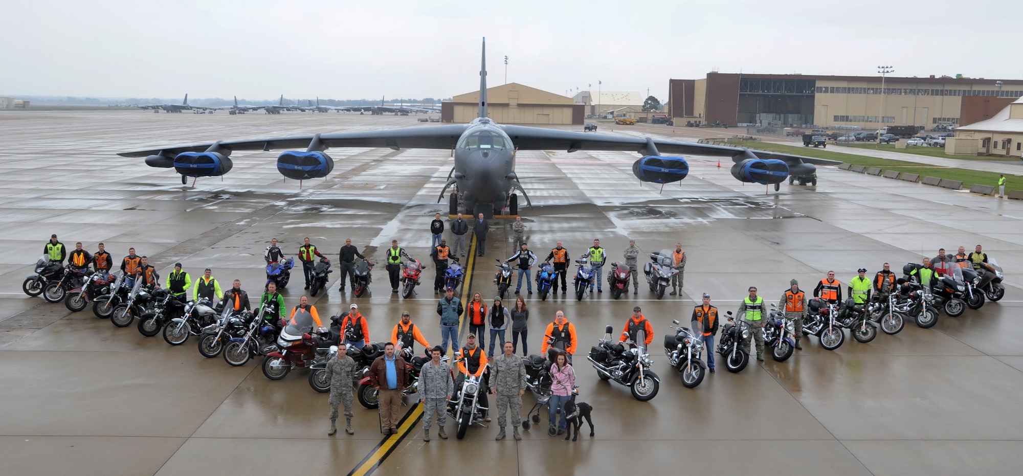 Col. Andrew Gebara, 2nd Bomb Wing commander, and Chief Master Sgt. Curtis Storms, 2nd BW command chief, pose with motorcyclists in front of a B-52H Stratofortress on Barksdale Air Force Base, La., Nov. 15, 2013. More than 30 riders posed for the photo as part of celebrating the second year of the Cajun Rumble. (U.S. Air Force photo/Senior Airman Joseph A. Pagán Jr.)