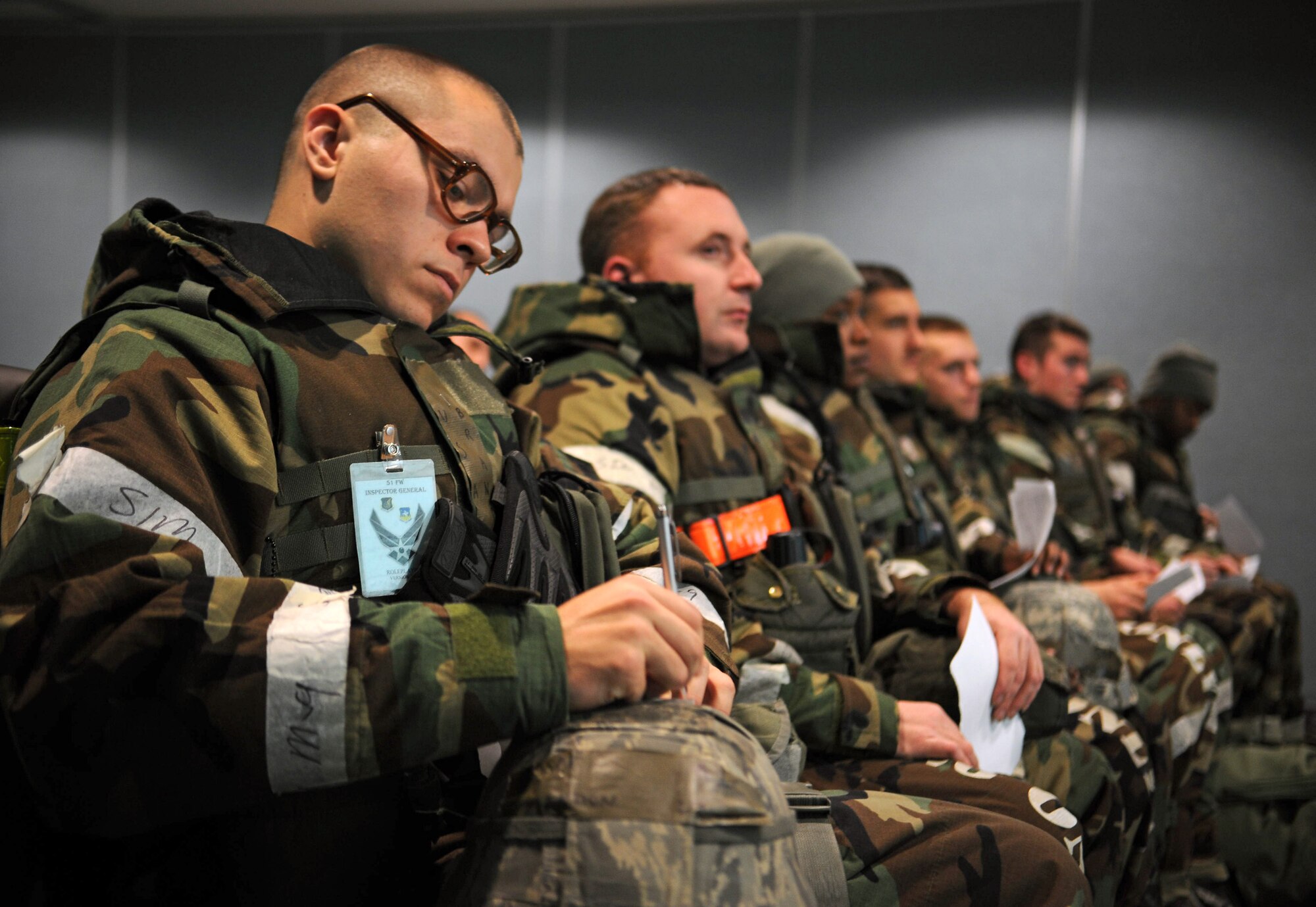 Airmen from the 51st Fighter Wing acting as follow-on forces listen as they are briefed about their new deployment location during Operational Readiness Exercise Beverly Bulldog 14-01 at Osan Air Base, Republic of Korea, Nov. 21, 2013. Briefings like these help Osan account for all new personnel while making sure everyone is properly equipped with the items necessary to complete their mission, such as equipment, paperwork and medication. (U.S. Air Force photo/Staff Sgt. Sara Csurilla)