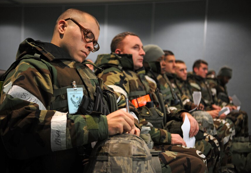 Airmen from the 51st Fighter Wing acting as follow-on forces listen as they are briefed about their new deployment location during Operational Readiness Exercise Beverly Bulldog 14-01 at Osan Air Base, Republic of Korea, Nov. 21, 2013. Briefings like these help Osan account for all new personnel while making sure everyone is properly equipped with the items necessary to complete their mission, such as equipment, paperwork and medication. (U.S. Air Force photo/Staff Sgt. Sara Csurilla)
