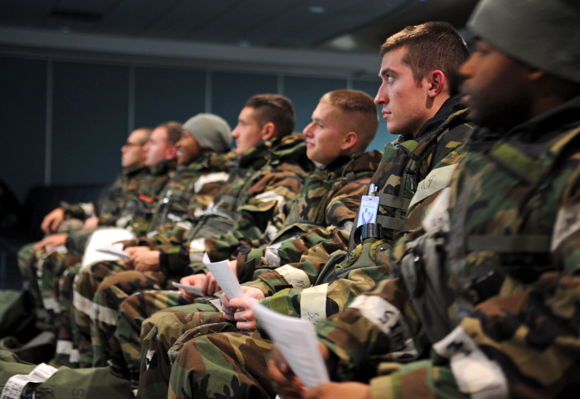 Airmen from the 51st Fighter Wing acting as follow-on forces listen as they are briefed about their new deployment location during Operational Readiness Exercise Beverly Bulldog 14-01 at Osan Air Base, Republic of Korea, Nov. 21, 2013. Part of Osan’s mission during a contingency operation would be to receive follow-on forces, and with exercises like BB 14-01, Airmen practice and perfect their skills to maintain operations during war. (U.S. Air Force photo/Staff Sgt. Sara Csurilla)
