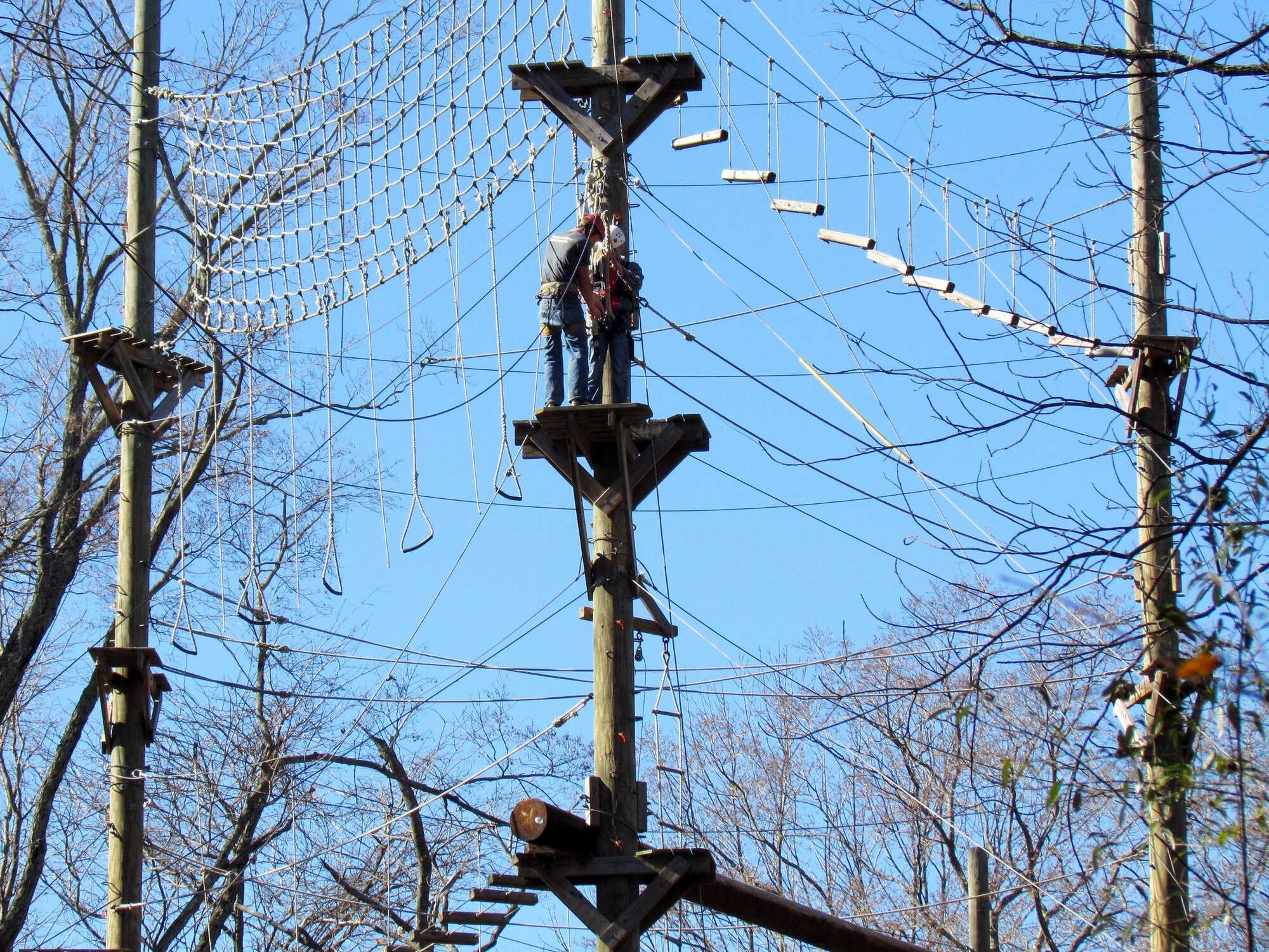 A Scott Airman prepares to zip-line Nov. 1 at the Touch of Nature Environmental Center near Carbondale, Ill. The men participated in outdoor activities, such as zip-lining and building a campfire.  The women’s retreat was hosted at the King’s House Retreat Center in Belleville where Airmen completed a self-defense workshop and did yoga.  Both groups completed wellness plans during the weekend. (U.S. Air Force photo/Master Sgt. Willie Williams)