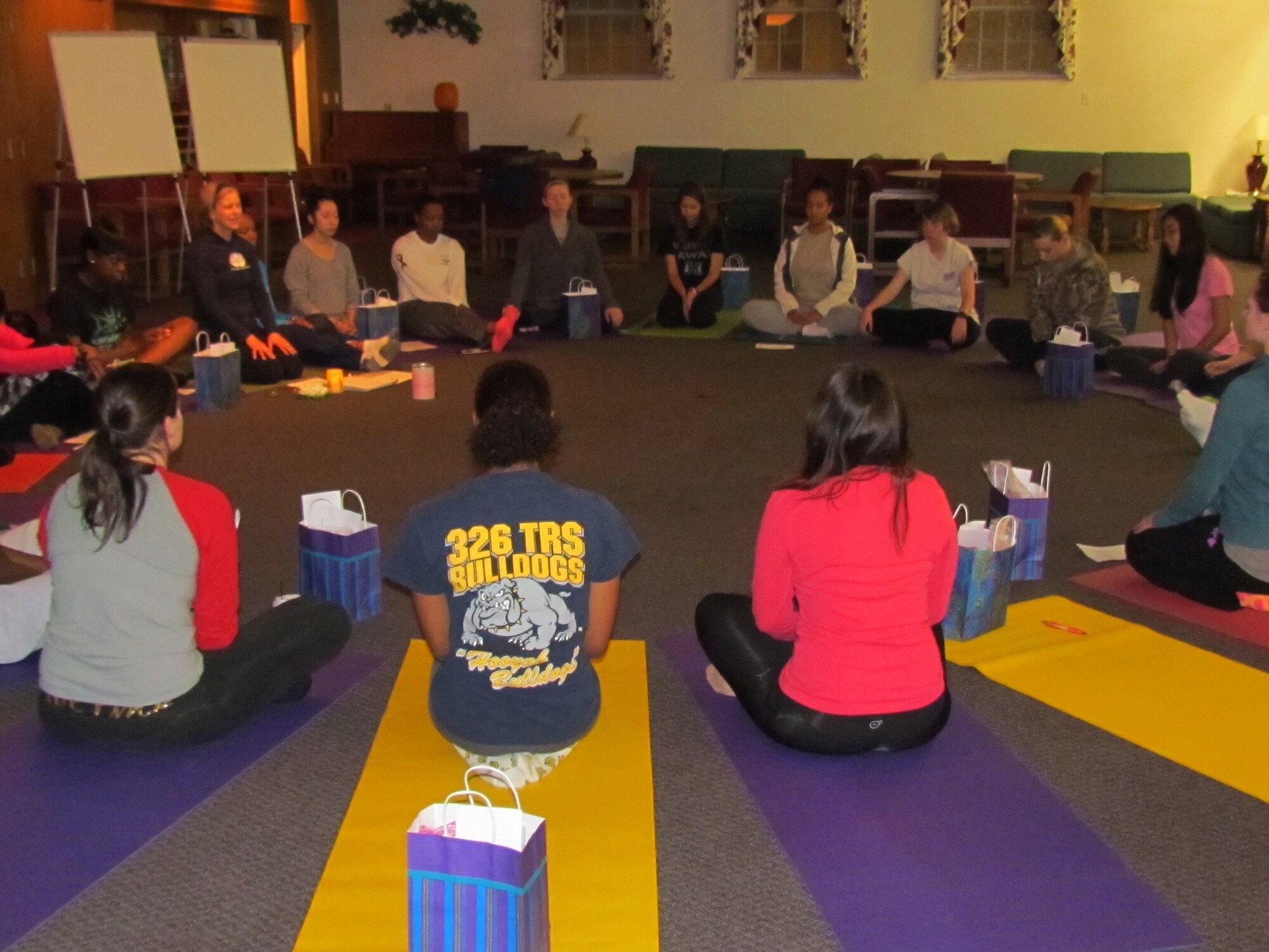 The women's retreat was an overnight event put on by the chapel to build relationships between junior enlisted members Nov. 9, 2013 at The King's House Retreat Center in Belleville, Ill. The event gave the ladies an opportunity to release stress by participating in a yoga exercise, as well as a self-defense workshop and worked on a wellness plan. (Courtesy photo)