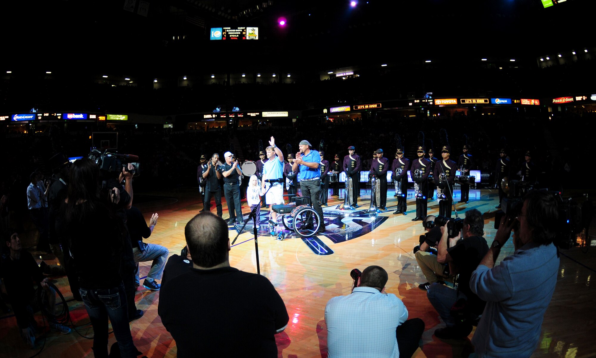 Christopher Paulsen, a disabled veteran, is presented a sports wheel-chair during a military appreciation night Nov. 13, 2013, at the Sleep Train Arena in Sacramento Calif. Chris sustained a serious injury to his left leg while serving in the Navy aboard the USS Constellation. (U.S. Air Force photo by Airman 1st Class Bobby Cummings/Released)