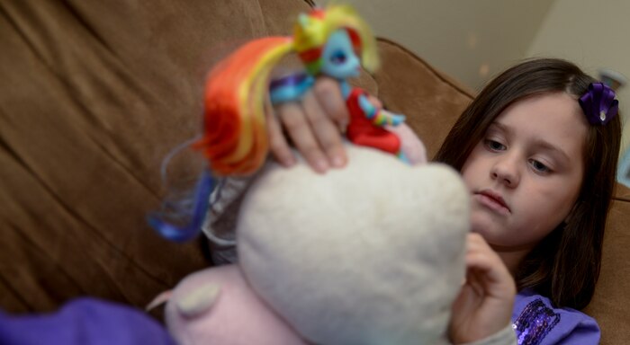 Seven year old Evelyn Hill plays with her dolls Nov. 13, 2013, at Joint Base Charleston – Air Base, S.C. Evelyn was diagnosed with epilepsy in 2010 at the age of 4. Evelyn is the daughter of Senior Airman Jessica Jordan, 315th Aircraft Maintenance Squadron hydraulic mechanic, and Senior Airman Ryan Jordan, 437th Aircraft Maintenance Squadron electronic warfare technician. Epilepsy is a brain disorder in which a person has repeated seizures or convulsions. (U.S. Air Force photo/ Airman 1st Class Chacarra Neal)