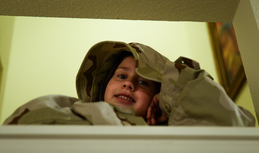 Seven-year-old Evelyn Hill poses in her father’s camouflage uniform Nov. 13, 2013, at Joint Base Charleston – Air Base, S.C. Evelyn is the daughter of Senior Airman Jessica Jordan, 315th Aircraft Maintenance Squadron hydraulic mechanic, and Senior Airman Ryan Jordan, 437th Aircraft Maintenance Squadron electronic warfare technician. Evelyn was diagnosed with epilepsy in 2010 at the age four. Epilepsy is a brain disorder in which a person has repeated seizures or convulsions. (U.S. Air Force photo/ Senior Airman Dennis Sloan) 