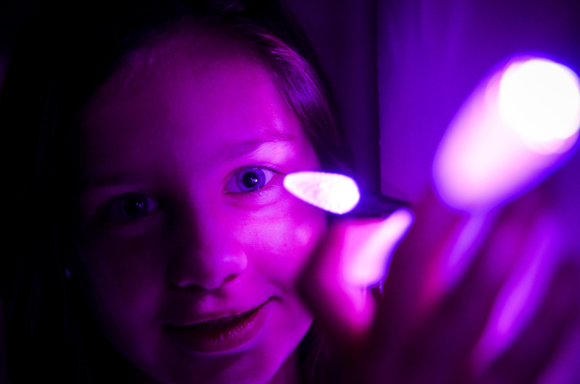 Seven year old Evelyn Hill lean against the pole outside of her house as she looks at the lights that are up in honor of Epilepsy Awareness Month Nov. 13, 2013, at Joint Base Charleston – Air Base, S.C. Evelyn is the daughter of Senior Airman Jessica Jordan, 315th Aircraft Maintenance Squadron hydraulic mechanic, and Senior Airman Ryan Jordan, 437th Aircraft Maintenance Squadron electronic warfare technician. Evelyn was diagnosed with epilepsy in 2010 at the age of 4. Epilepsy is a brain disorder in which a person has repeated seizures or convulsions. (U.S. Air Force photo/ Senior Airman Dennis Sloan)