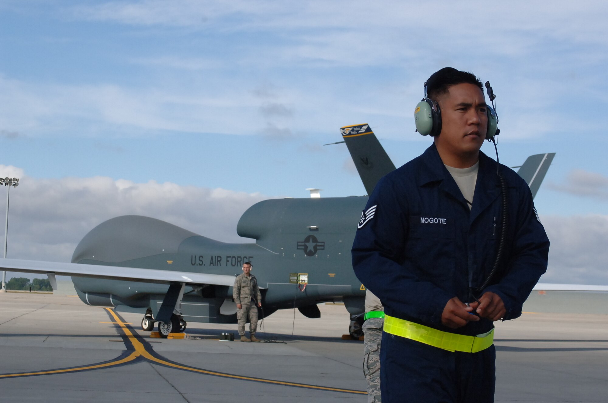 Staff Sgt. Rod Mogote, 69th Maintenance Squadron crew chief, walks toward a maintenance vehicle after performing final safety checks on the first RQ-Block 40 Global Hawk to fly into war from Grand Forks Air Force Base, N.D. on Sept. 19, 2013, Mogote was part of the maintenance team from Grand Forks Air Force Base, N.D., which prepared the Block 40 for the historic flight. (U.S. Air Force photo/Staff Sgt. Luis Loza Gutierrez)