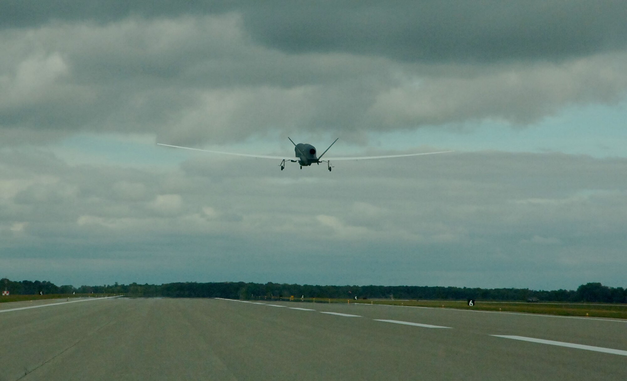 An RQ-Block 40 Global Hawk operated by the 69th Reconnaissance Group takes off from Grand Forks Air Force Base, N.D., Sept. 19, 2013.The historic flight marked the first time the Block 40 deployed to war. (U.S. Air Force photo/Staff Sgt. Luis Loza Gutierrez) (This image was cropped to focus on the subject)