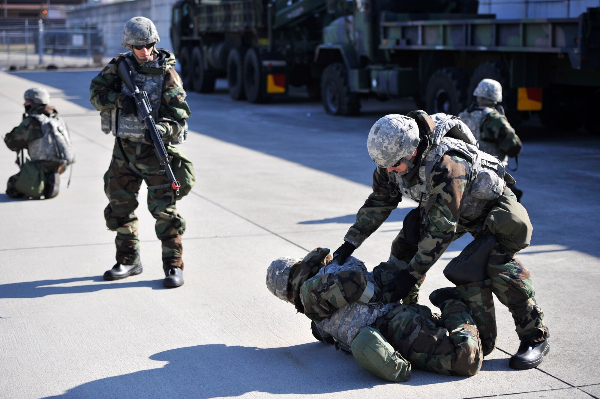U.S. Army Soldiers from the 35th Air Defense Artillery Brigade practice detaining civillians during Operational Readiness Exercise Beverly Bulldog 14-01 at Osan Air Base, Republic of Korea, Nov. 20, 2013. During OREs, Airmen and Soldiers perfect their ability to position, employ and sustain forces. (U.S. Air Force photo/Staff Sgt. Emerson Nuñez)  